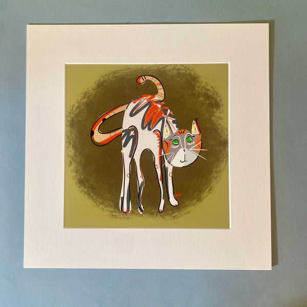 A matted print of a calico cat with a beige background.